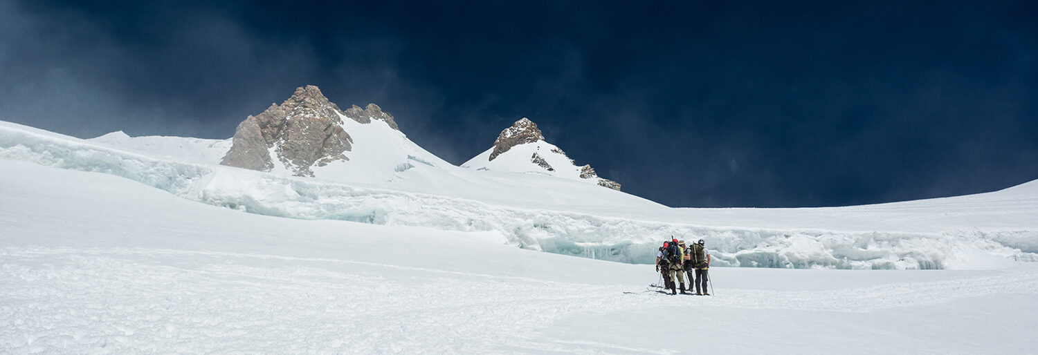 group-of-alpinists-on-a-glacier